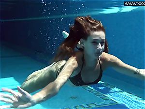 Tiffany Tatum unclothes bare underwater